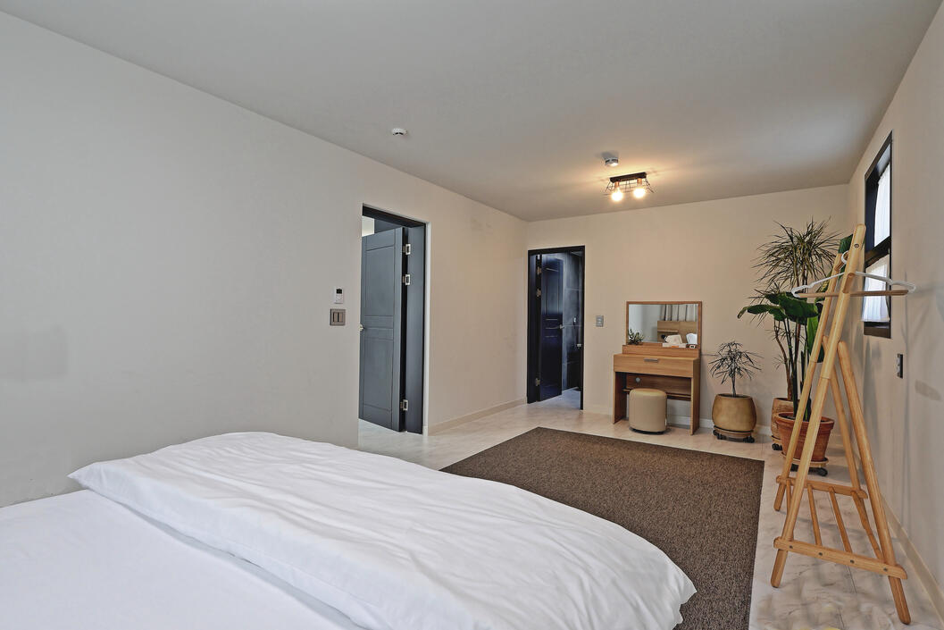 The master bedroom is spacious, private and relaxing.