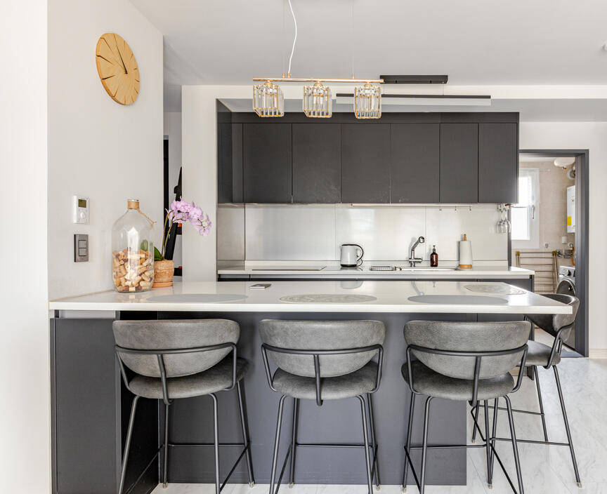 The dining and kitchen area. The open door on the side is the laundry room