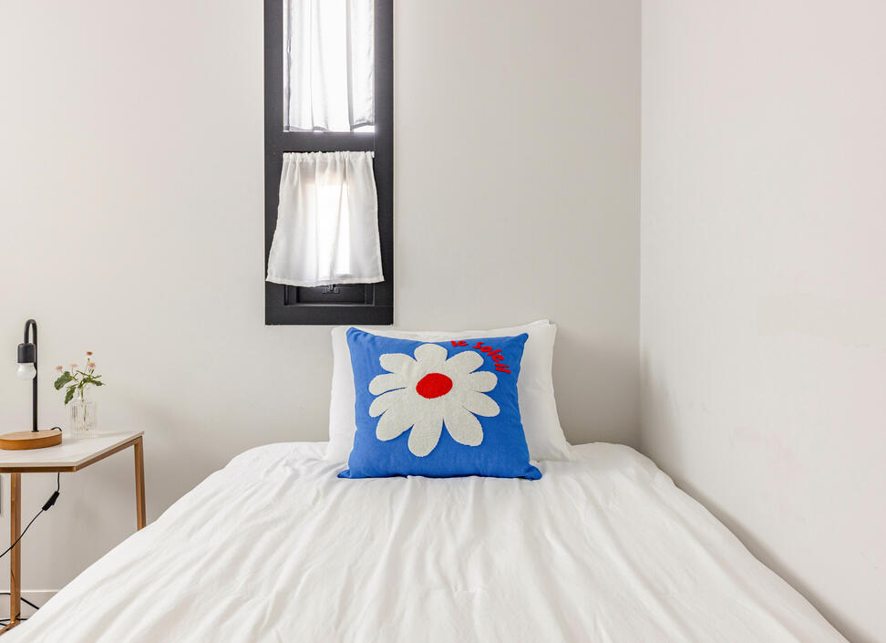 The second bedroom has a Super-single with night stand and lamp