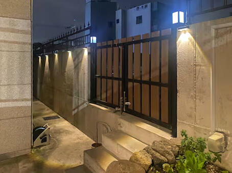 This is the back gate at night, located next to public parking. This is the back gate at night, located next to public parking.