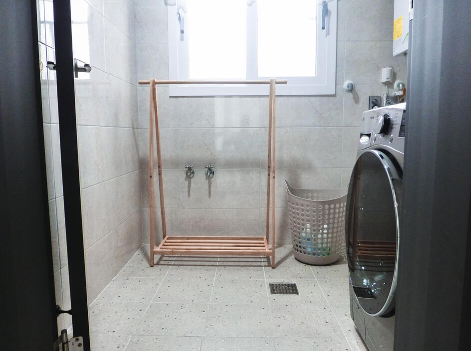 Finally, the laundry room with a drying rack and windows for a breeze