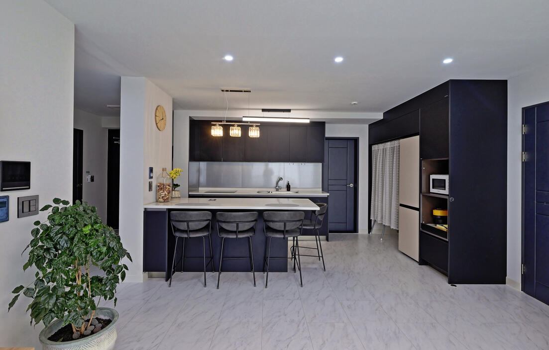 The dining and kitchen area. The open door on the side is the laundry room. The dining and kitchen area. The open door on the side is the laundry room.