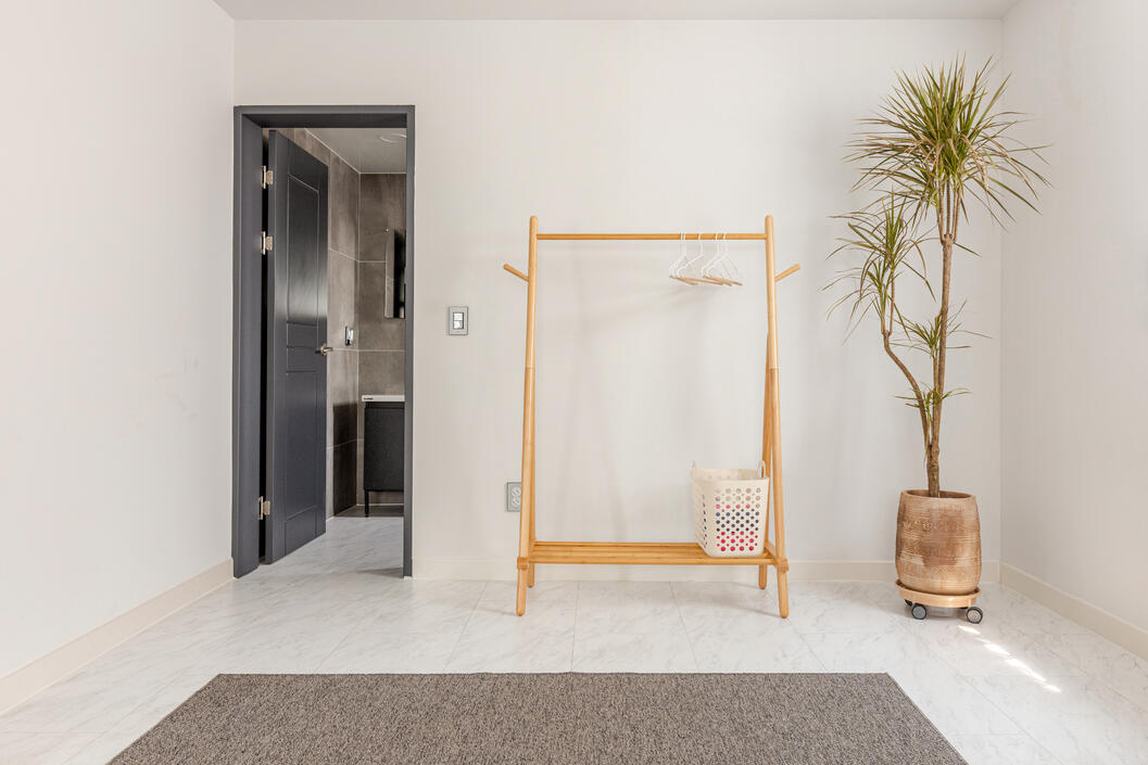 And a clothes rack for your convenience. The open door lead into the master bathroom